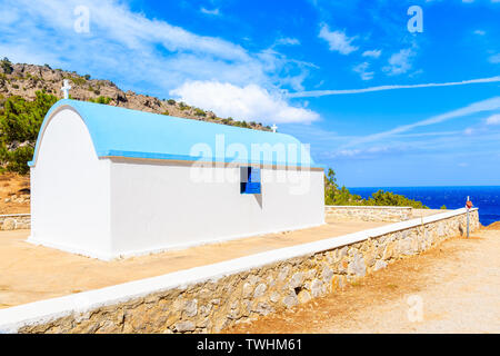 Typical white church in mountain landscape of Karpathos island near Achata bay, Greece Stock Photo