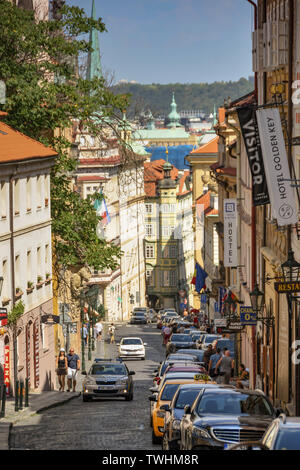 PRAGUE, CZECH REPUBLIC - JULY 2018: Steep narrow street in Prague leading up to Prague Castle. Stock Photo
