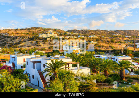 Beautiful holiday villas in tropical gardens in Ammopi village, Karpathos island, Greece Stock Photo