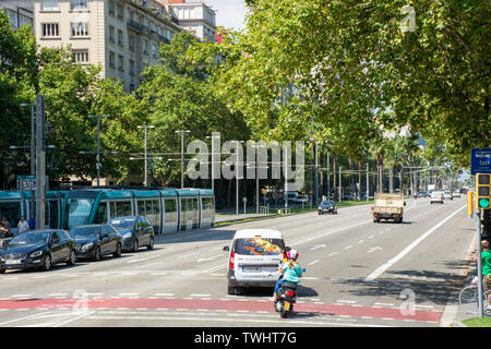 Barcelona, Spain - 27th July 2017 - Busy street with people crossing road Stock Photo