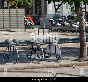 Barcelona, Spain - 27th July 2017 - Bike rack with helmet stand in Stock Photo