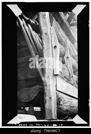 SHOWS KEEPERS WHICH HELD THE SLIDING BOLT TO LOCK DOOR; ALSO SHOWS FEED TROUGH AND HAY RACK (see HABS No. TN-160-13) IN BACKGROUND. SPIKES USED TO NAIL DOOR JAMBS TO WALL LOGS MADE FROM OLD HORSESHOES Date- July 1941; negative -10653 - Witt Shields Barn, Townsend, Blount County, TN Stock Photo