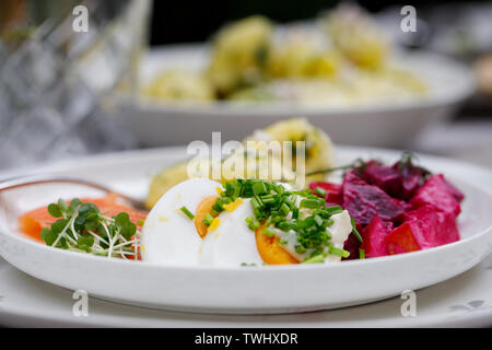 Scandinavian midsummer feast with potato salad,  salmon and beetroot Stock Photo