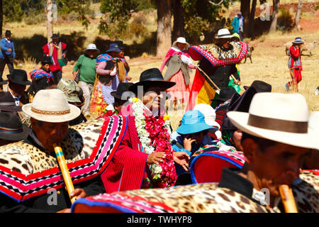 Bolivia 20th June 2019: Quena quena musicians accompany Bolivian president Evo Morales Ayma (centre) as he leads an International Hike along a section of the Qhapaq Ñan Inca road near Desaguadero. The event was organised by the Ministry of Cultures & Tourism to promote tourism and Bolivia's indigenous cultures. Stock Photo