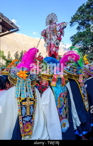 Choquekillka Festival procession. Women carrying Señor de Choquekillka image in the Peruvian Sacred Valley of the Incas city of Ollantaytambo, Peru. Stock Photo