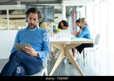 Businessman working on digital tablet at conference room in a modern office Stock Photo