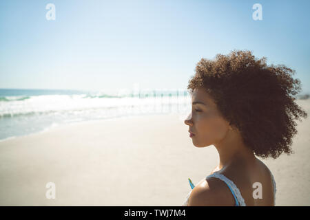 Woman standing on the beach Stock Photo