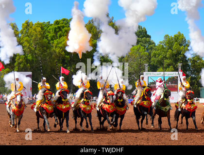 Rabat, Morocco. 20th June, 2019. Performers in traditional costumes ride horses during a Fantasia horse show in Rabat, Morocco, on June 20, 2019. Fantasia is a traditional exhibition of horsemanship performed during cultural festivals and wedding celebrations. Credit: Xinhua/Alamy Live News Stock Photo