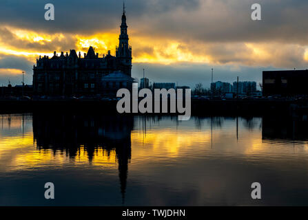 Silhouette of the historic port services building of Antwerp harbor at sunset, Belgium. Stock Photo
