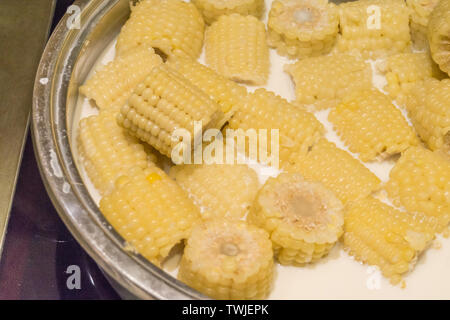 A pot of milk boiled corn close-up Stock Photo