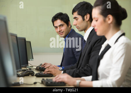 Office workers working in an office Stock Photo