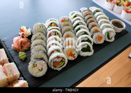 assorted sushi rolls, setup nicely on a table Stock Photo