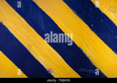 Safety stripes on construction site, Black and yellow Under construction sign over a grunge texture Stock Photo