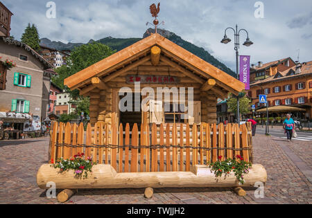 MOENA, ITALY - JULY 18, 2018: Beautiful little wooden house in the main square of Moena village, Italy Stock Photo