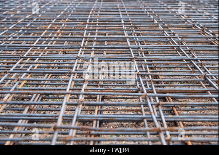 Weathered rusty steel grating construction on floor Stock Photo