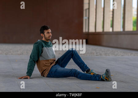 Portrait of young hipster man button up on gray suit casual poses at  studio. 5356807 Stock Photo at Vecteezy
