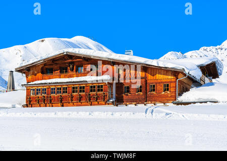 View of mountain hut restaurant on ski slope in Austrian Alps in beautiful winter season, Serfaus Fiss Ladis, Tirol, Austria. Stock Photo