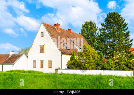 White traditional house in spring landscape of Burgerland in Strem village, Austria Stock Photo