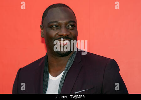 Edinburgh, UK. 20th June, 2019. Writer and Director, Adewale Akinnuoye-Agbaje, at a photo call for the UK film premiere of Farming, at Filmhouse, Edinburgh, Scotland. Farming is 'an enthralling and moving real-life story' from Adewale. This screening is part of the Best of British strand at the Edinburgh International Film Festival 2019 (EIFF), which runs until June 30. Credit: SOPA Images Limited/Alamy Live News Stock Photo