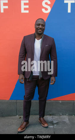 Edinburgh, UK. 20th June, 2019. Writer and Director, Adewale Akinnuoye-Agbaje, at a photo call for the UK film premiere of Farming, at Filmhouse, Edinburgh, Scotland. Farming is 'an enthralling and moving real-life story' from Adewale. This screening is part of the Best of British strand at the Edinburgh International Film Festival 2019 (EIFF), which runs until June 30. Credit: SOPA Images Limited/Alamy Live News Stock Photo