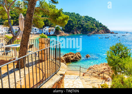 Steps to sandy beach and sea bay in Tamariu seaside town, Costa Brava, Spain Stock Photo