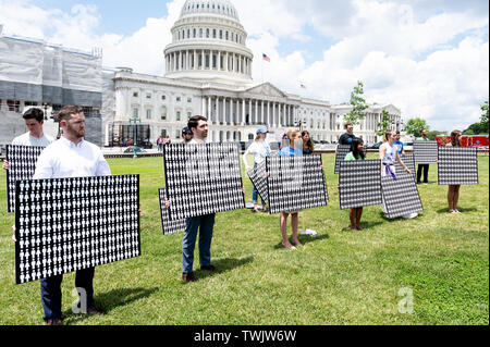 Washington, United States. 20th June, 2019. Participants hold boards during the event in front of the Capitol to urge the passage of the H.R. 8 universal (gun ownership) background checks legislation. Event was held at the grass on the eastern side of the U.S. Capitol in Washington, DC. Credit: SOPA Images Limited/Alamy Live News Stock Photo
