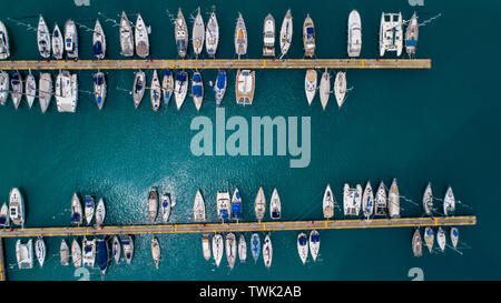 Aerial view of yachts and boat berthed in the marina and clear water. Aerial view of the Marina in Turkey. Holiday icons . Stock Photo