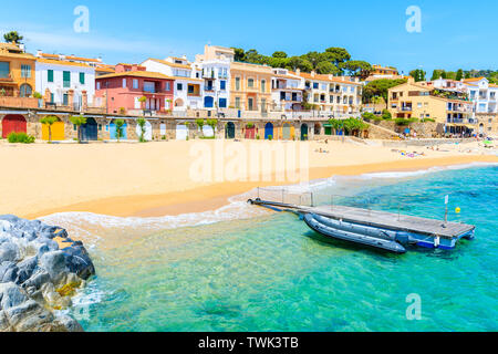 Boats on Canadell beach in Calella de Palafrugell village with colorful houses on shore, Costa Brava, Catalonia, Spain Stock Photo