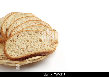Bread with wheat bran in wicker plate on white background Stock Photo