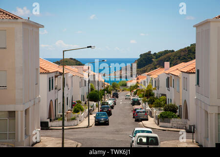 Street in the town of Vila Franca do Campo with islet and ocean on the background. Sao Miguel, Azores islands, Portugal. Stock Photo