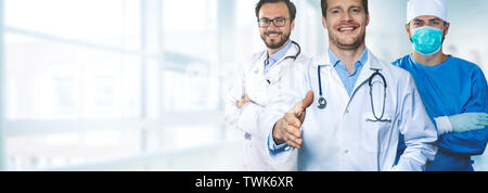 team of male medical doctors standing in hospital hallway copy space Stock Photo