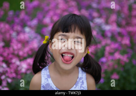 Portrait of a girl sticking her tongue out Stock Photo