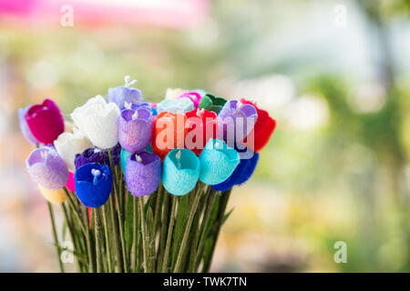 Bouquet colorful craft flowers on blurred background Stock Photo