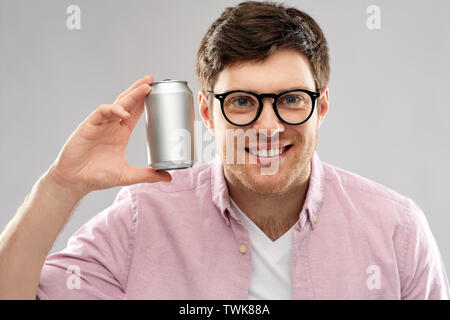 happy young man holding tin can with soda Stock Photo