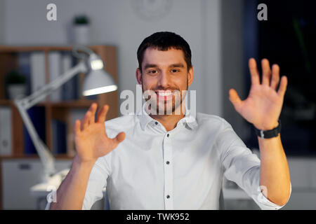 businessman using gestures at night office Stock Photo
