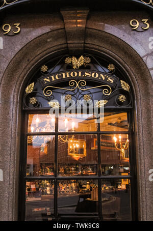 Looking through a window into a typical English pub in London. London, England - November 24, 2009. Stock Photo