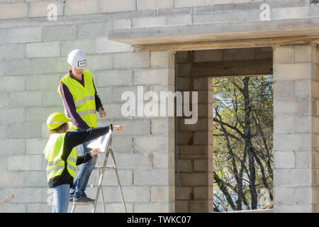 Women in construction trades, male sector, gender equality Stock Photo