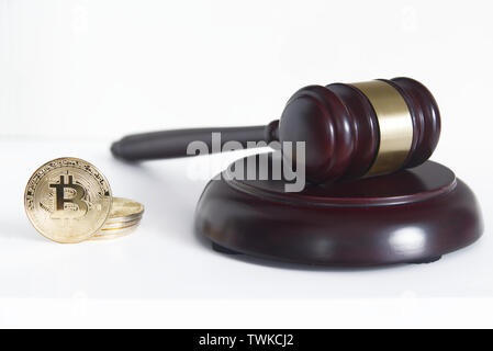 Judge mace next to some bitcoin currency coins from above. Lgislation concept and empty copy space for Editor's text. Stock Photo