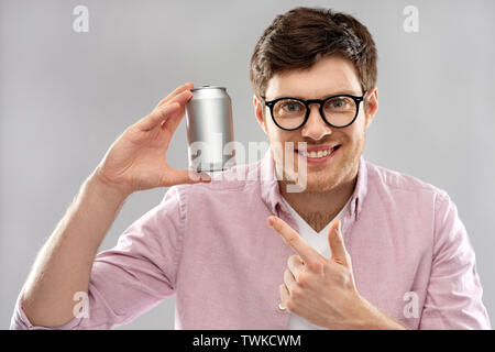 happy young man holding tin can with soda Stock Photo