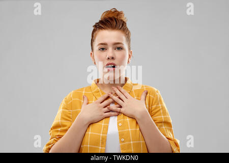 shocked or surprised red haired teenage girl Stock Photo