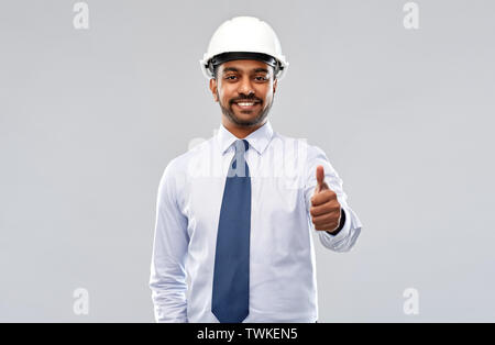 architect or businessman in helmet shows thumbs up Stock Photo