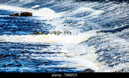 The stream of the river Shannon in the town of Athlone in the county of Westmeath Ireland, clean and crystal clear water moving downstream Stock Photo