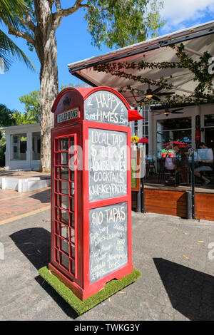 Old Brritish red phone booth being used to display the menu outside Sarayi Restaurant in Palm Cove, Cairns Northern Beaches, Far North Queensland, FNQ Stock Photo