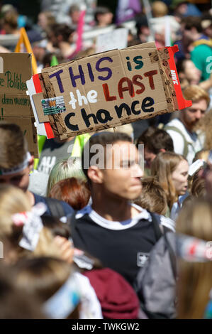 Aachen, Germany. 21st June, 2019. Young participants of the climate demonstration Fridays for Future hold up their posters. Credit: Henning Kaiser/dpa/Alamy Live News