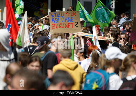Aachen, Germany. 21st June, 2019. Young participants of the climate demonstration Fridays for Future hold up their posters. Credit: Henning Kaiser/dpa/Alamy Live News
