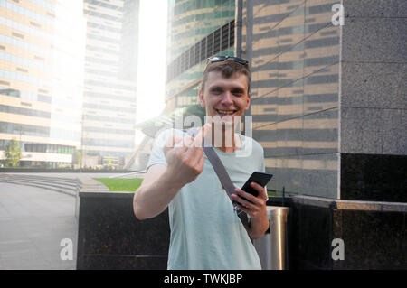 Handsome young man. Shows the middle finger of the right hand Stock Photo