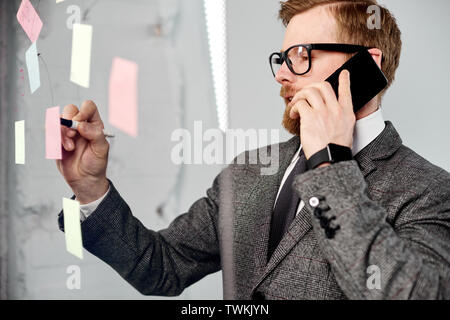 mid age businessman working on new project at modern office Stock Photo