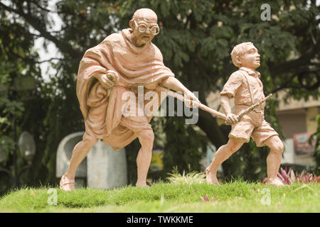 Bangalore, India, June 4, 2019 : Sculpture of Mahatma Gandhi and child, Child moving by Holding the Stick of Mahatma Gandi at bengaluru, India Stock Photo