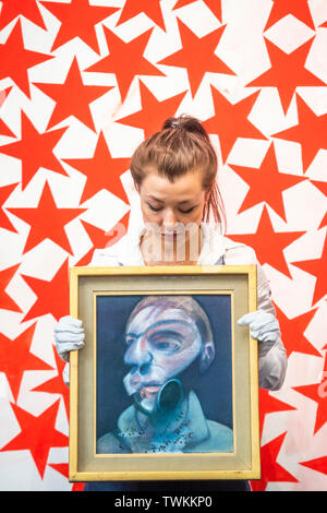 London, UK. 21st June, 2019. Francis Bacon, Self-Portrait, 1975, Estimate: £15,000,000-20,000,000, and Charline von Heyl, Cluster, 2015, Estimate: £50,000-70,000 - Preview of the Contemporary Sales at Sotheby's London. The auctions will take place on 26th June. Credit: Guy Bell/Alamy Live News