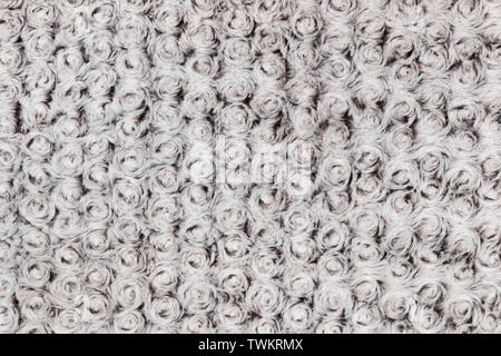Background and texture of grey artificial fur with round curls. Close-up Stock Photo